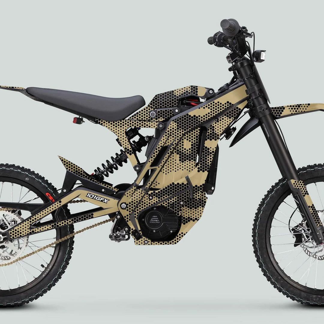 E Ride Pro SS Graphics Kit HEXOCAM SAND on a full-suspension e-bike, featuring tan-and-black hex-pattern camouflage, knobby tires, and central electric motor.