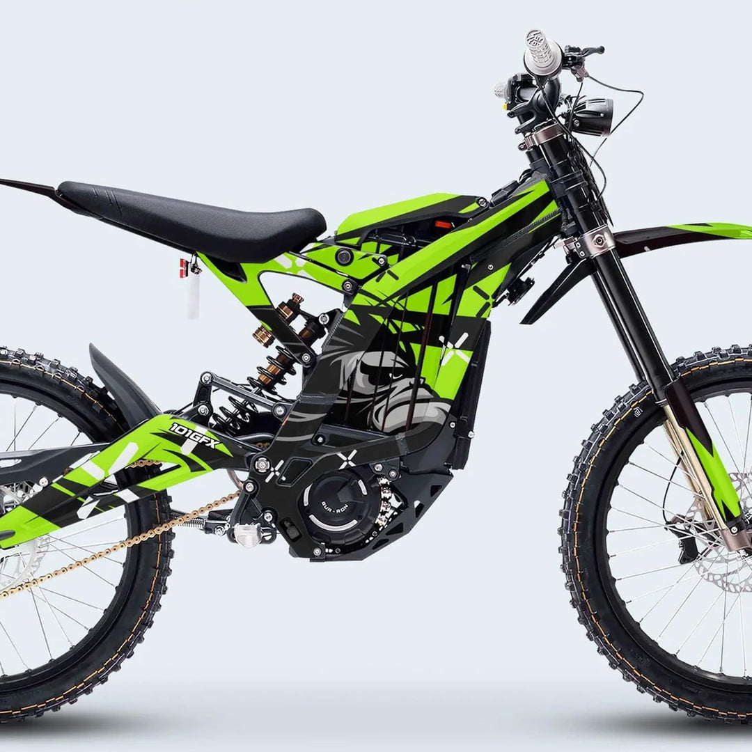 Surron Light Bee X Graphics Kit CRAZY MONKEY Green on an electric dirt bike with knobby tires, telescopic suspension, disc brakes, and 101FGX decals.