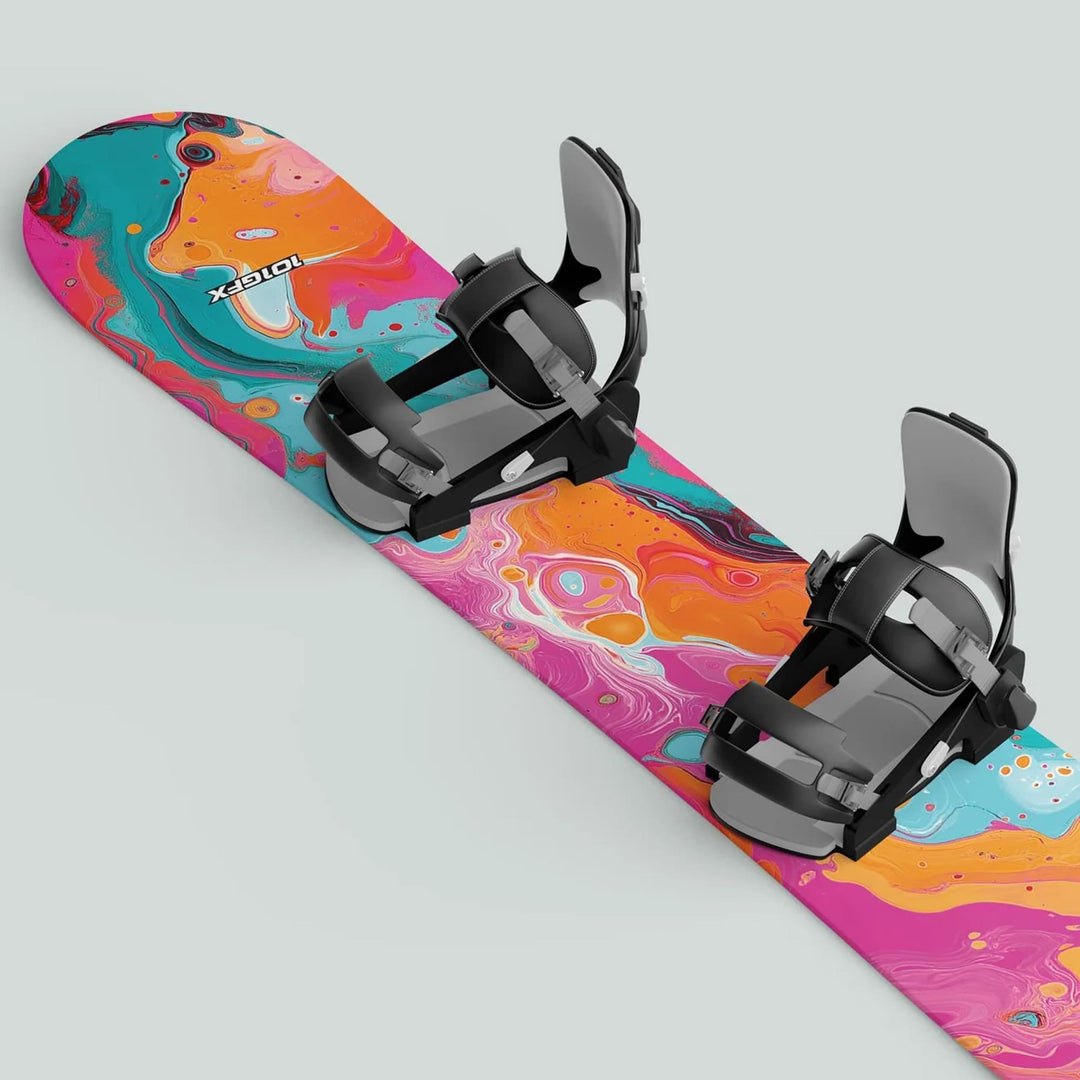 Snowboard Wrap FLUID PINKY featuring vibrant swirl-art graphic with black and gray bindings, offering style, durability, and easy application for snowboard enthusiasts.