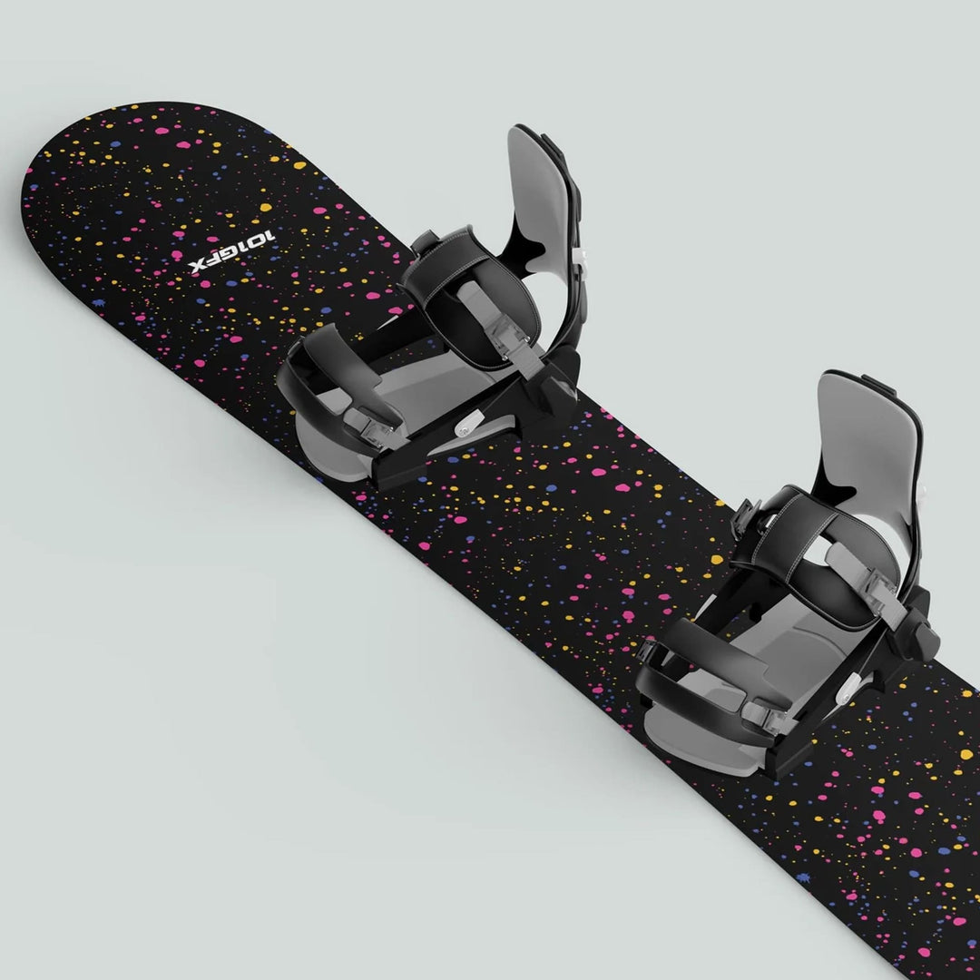 Snowboard Wrap SPLATS BLACK with vibrant splatter graphics, shown with black strap bindings, offers style and protection for your snowboard.
