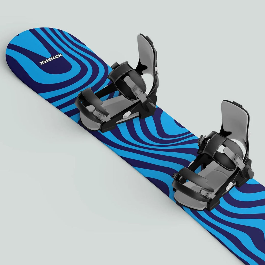 Snowboard with blue WAVY CYAN NAVY skin decals, featuring wavy stripes, black bindings, and grey straps, offering style and protection for snowboarding enthusiasts.