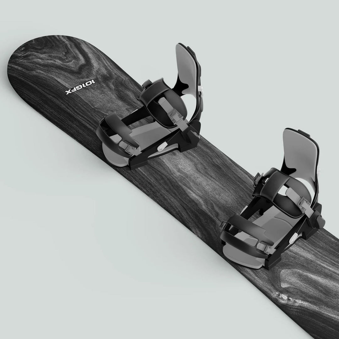 Snowboard Wrap WOOD PLANK GREY on a snowboard with black bindings; enhances aesthetics and protects against scratches with its weather-resistant, wood-grain design.