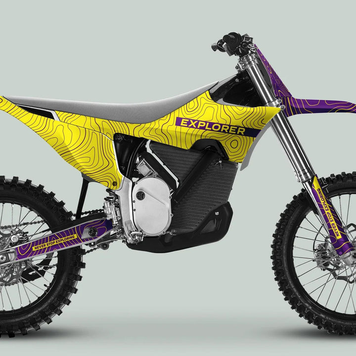 Stark Varg Graphics Kit EXPLORER YELLOW PURPLE Decals on electric dirt bike, featuring bold contour-line graphics, knobby tires, and a sleek, streamlined design.