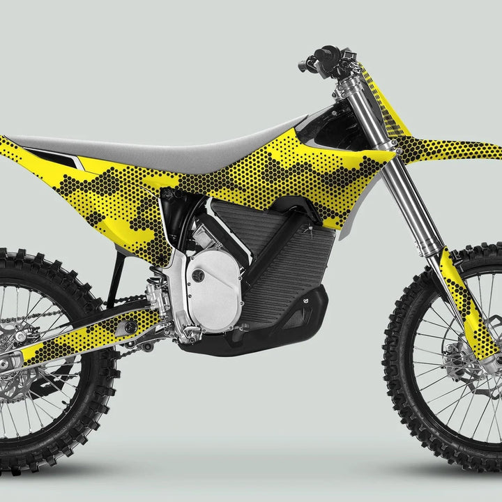 Stark Varg Graphics Kit HEXOCAM Yellow Decals Stickers on a motocross bike, showcasing its distinctive honeycomb camo pattern and durable design for enhanced vehicle styling.