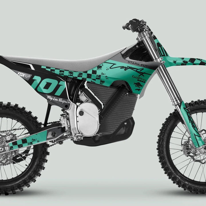 Stark Varg Graphics Kit RACE BLACK Mint Decals Stickers on an electric motocross dirt bike with knobby tires and teal-black branding, enhancing aesthetic and style.