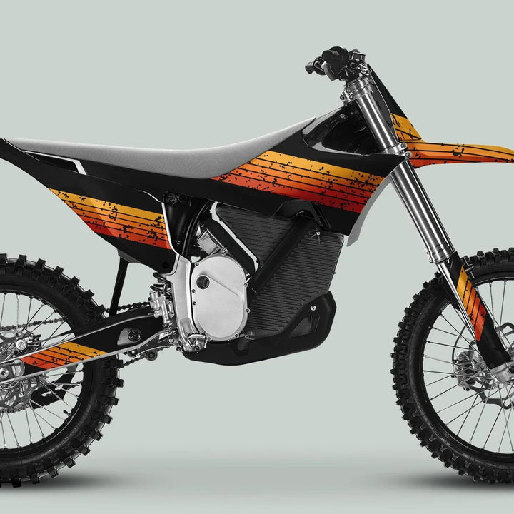 Side profile of a motocross bike featuring Stark Varg Graphics Kit RETRO ORANGE Decals Stickers, showcasing vintage flair on body panels with a grunge styling.