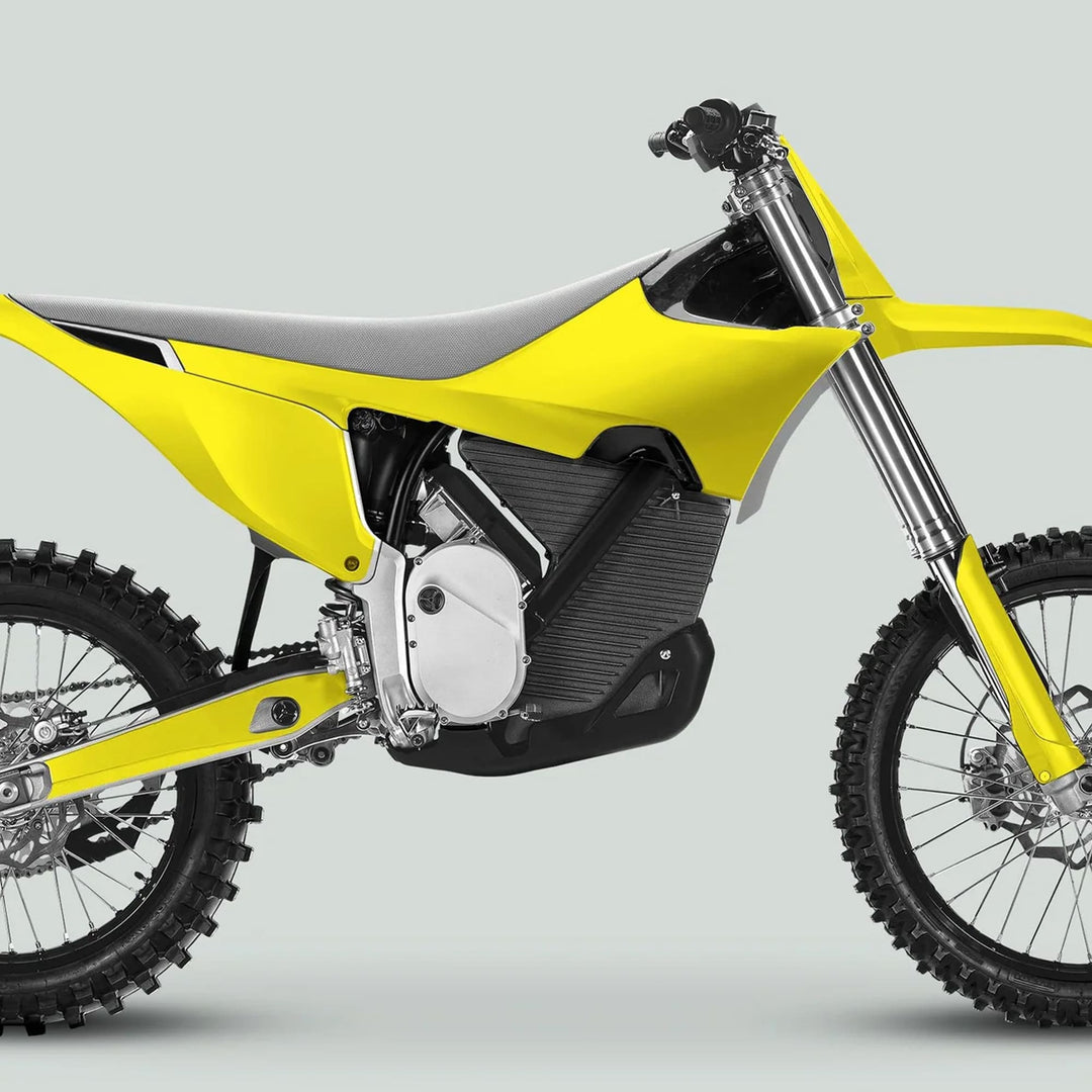 Side-view of an electric dirt bike showcasing Stark Varg Graphics Kit SOLID COLOR YELLOW Stickers, featuring durable stickers on fenders, forks, and number plate.