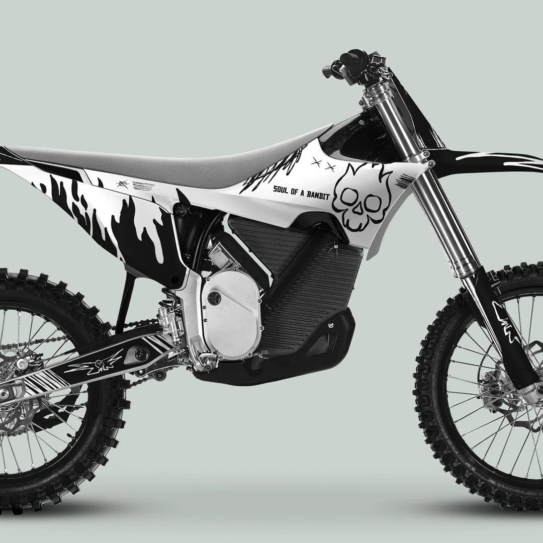 Stark Varg Graphics Kit SOUL FLAME featuring black-and-white flame and skull motifs on a dirt-bike, enhancing aesthetics for Stark Future Varg (2023+).