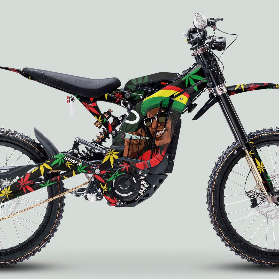 Sur Ron Light Bee X Graphics Kit Stickers Cannabis Style Red Green Yellow, featuring Rastafarian motifs and cannabis leaves on a custom electric dirt bike wrap.