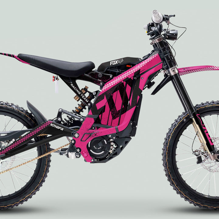 Side profile of Surron Light Bee X Graphics Kit FOX DUST Pink Black on an electric dirt bike, featuring durable vinyl with a glossy finish and vibrant design.