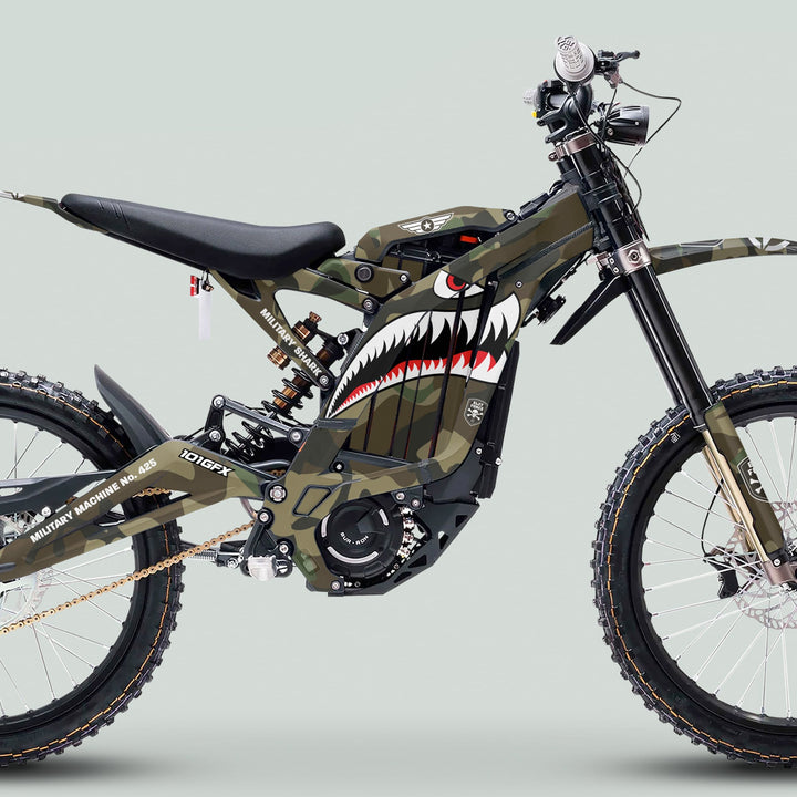 Surron Light Bee X Graphics Kit MILITARY SHARK Camo on electric dirt bike with camo livery, shark-mouth graphic, and military markings; features durable, weather-resistant materials.