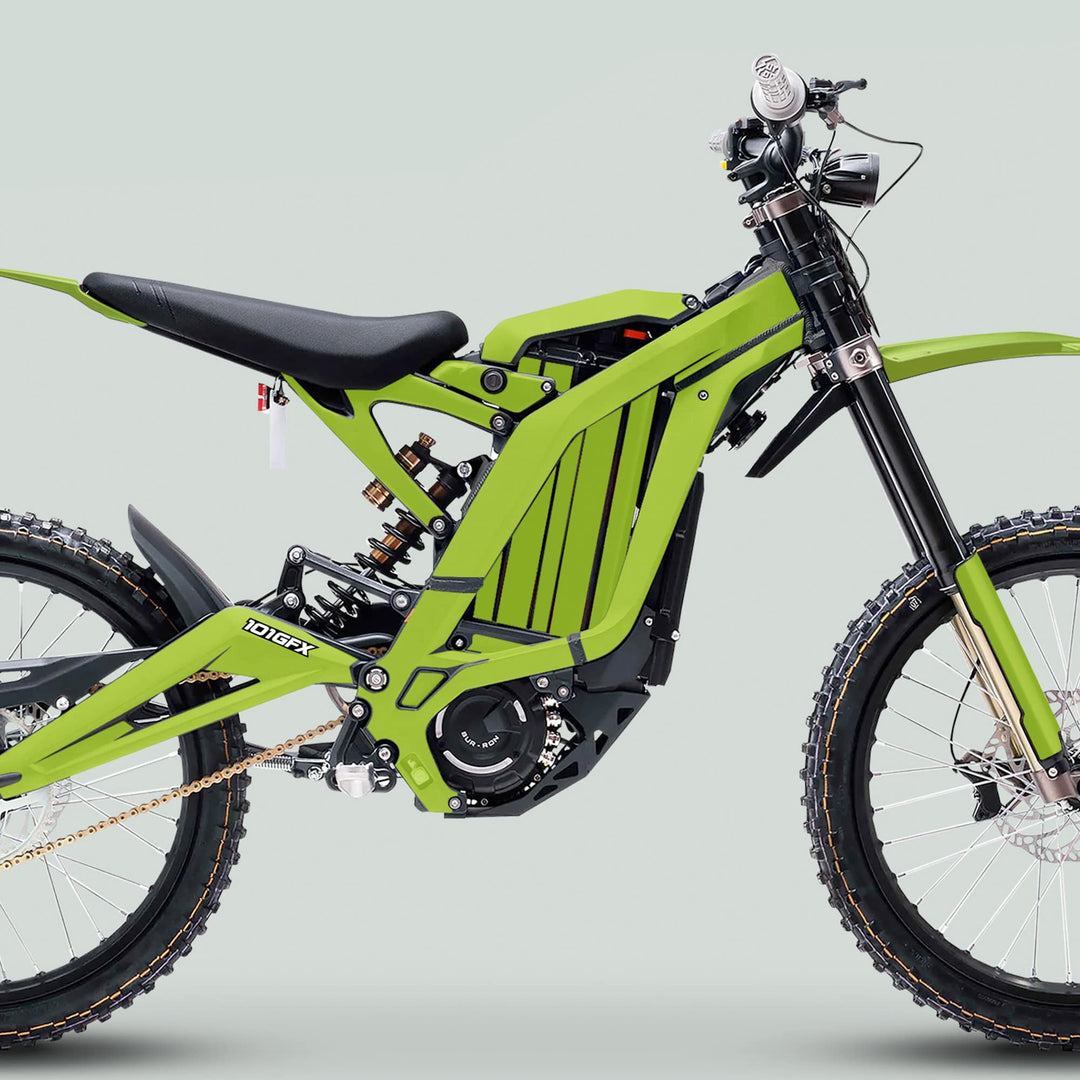 Side profile of an electric dirt bike featuring the Surron Light Bee X Graphics Kit MONO COLOR Green, showcasing a vibrant aluminum frame and durable decals.