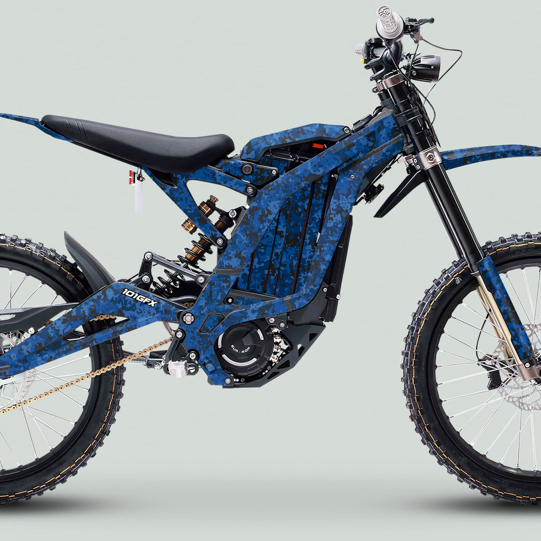 Surron Light Bee X Graphics Kit SQUARE TEK Blue on a digital blue-camo e-bike, showcasing glossy stickers enhancing aesthetics and protection with easy application and custom fit.