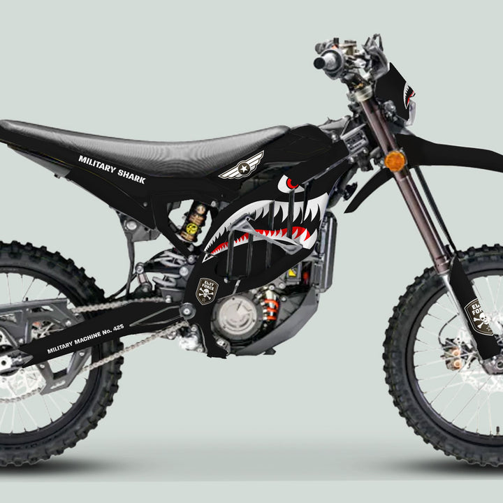 Surron Ultra Bee Graphics Kit MILITARY SHARK Black, featuring shark-mouth graphics and stenciled text, enhances your dirt bike with durable, camouflage-style decals.