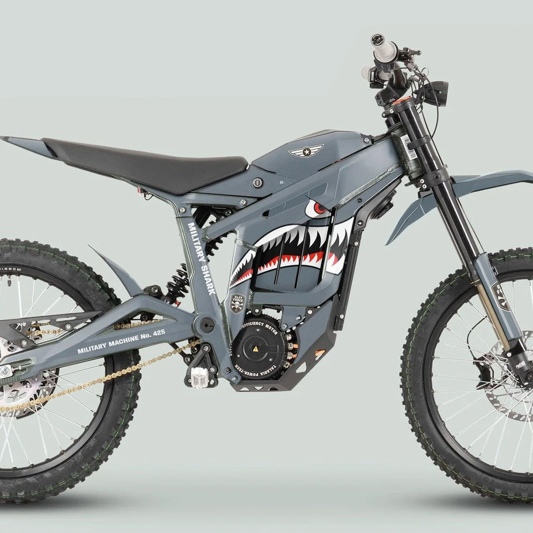Military-styled electric off-road bike with Talaria Sting MX3 MX4 Graphics Kit MILITARY SHARK Grey, showcasing shark mouth graphics, full suspension, and knobby tires.