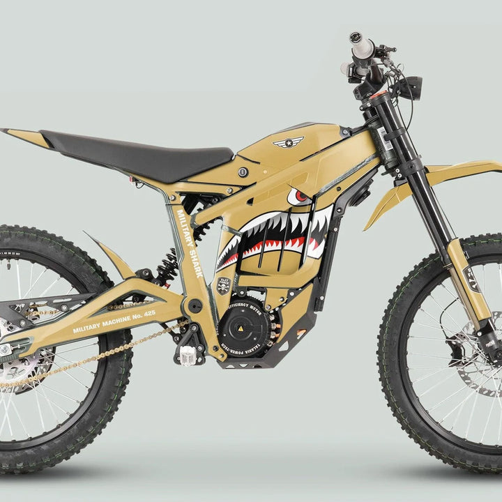 Side-view of Talaria Sting MX3 MX4 Graphics Kit MILITARY SHARK Sand on an electric dirt bike with matte tan color and shark-mouth graphic.