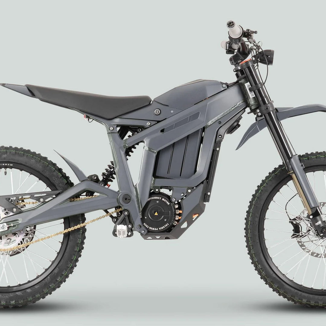 Side view of an electric dirt bike showcasing the Talaria Sting MX3 MX4 Graphics Kit SOLID COLOR GREY, highlighting the bike's frame, suspension, and knobby tires.