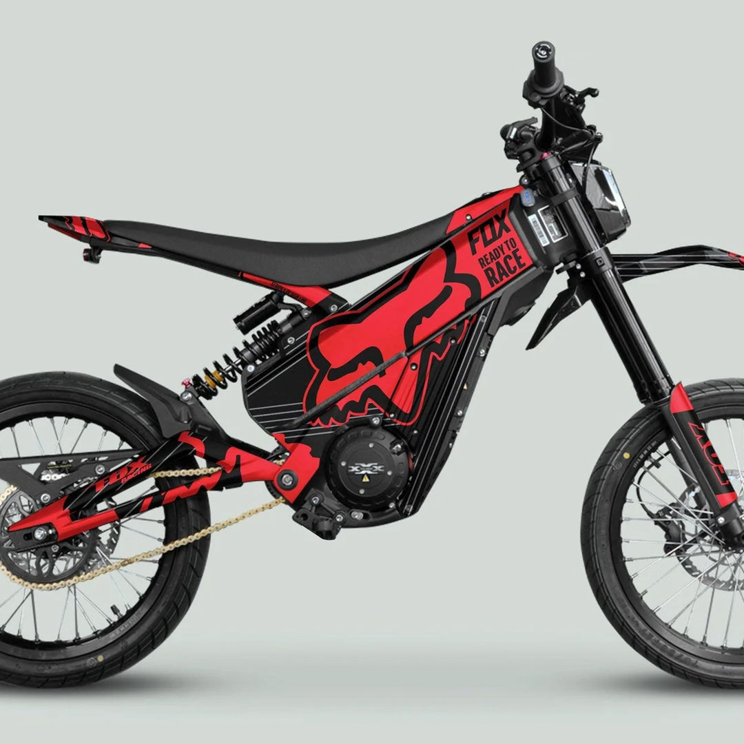 Talaria XXX Graphics Kit FOX STRIPES Black Red on an electric off-road motorcycle featuring durable, custom-fit panels with Fox branding, enhancing style and protection.